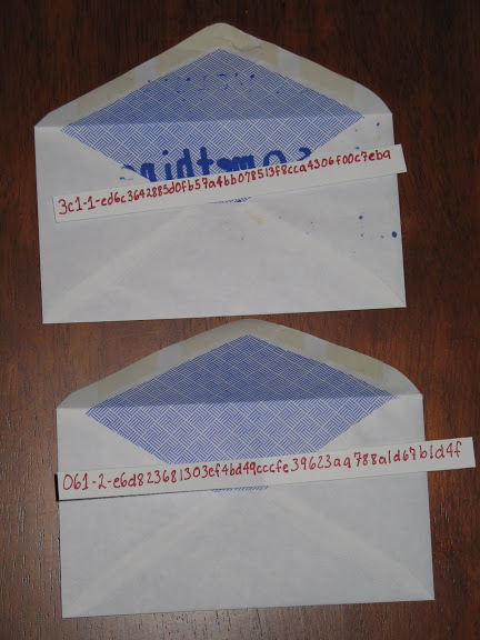 Two opened envelopes with secret shares
